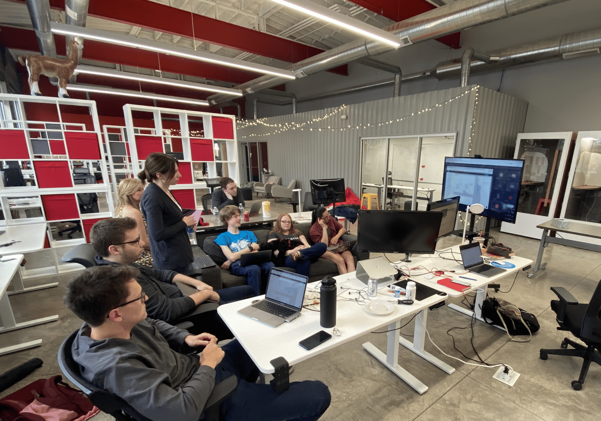 Group of Argylers in the office looking at a screen collaborating