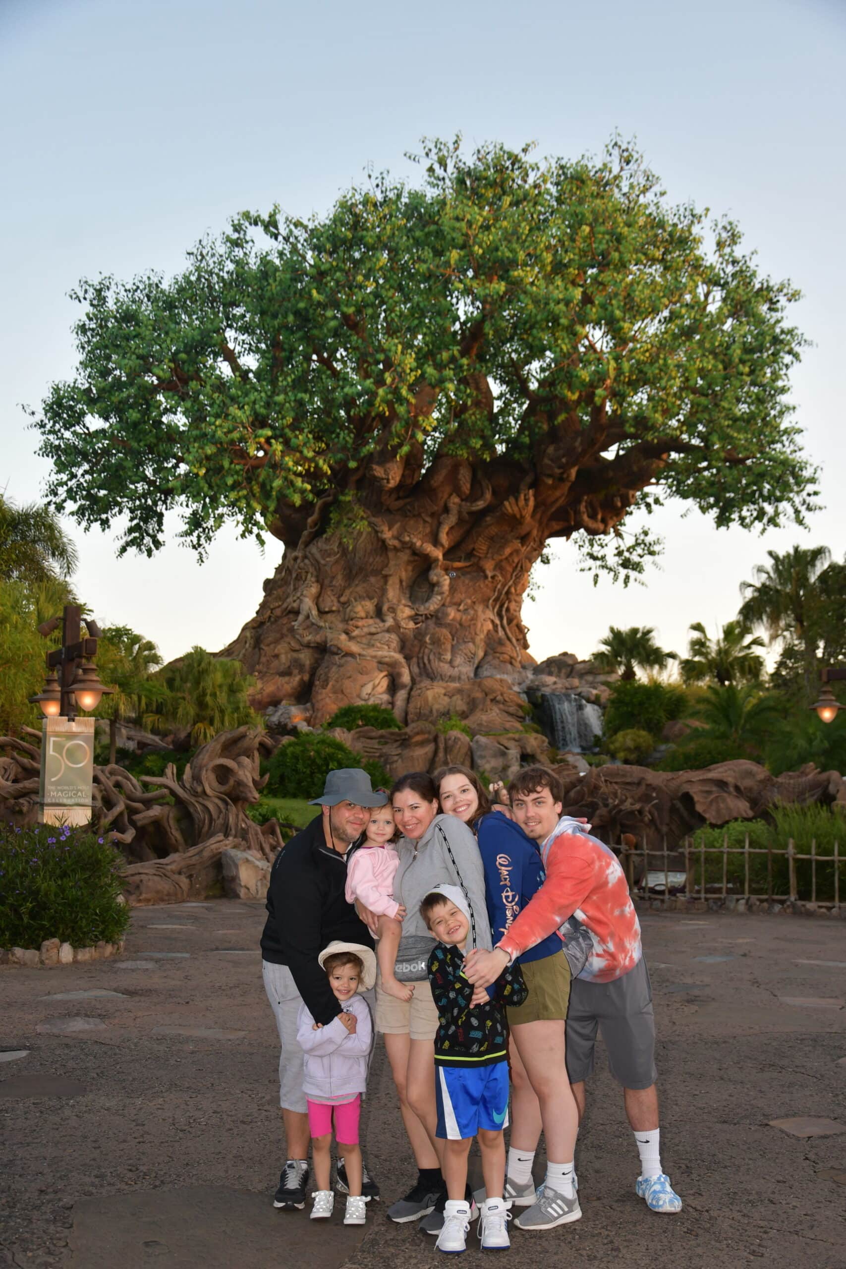 Red Argyle's Morgan Bayer and family at Disney in front of the Tree of Life