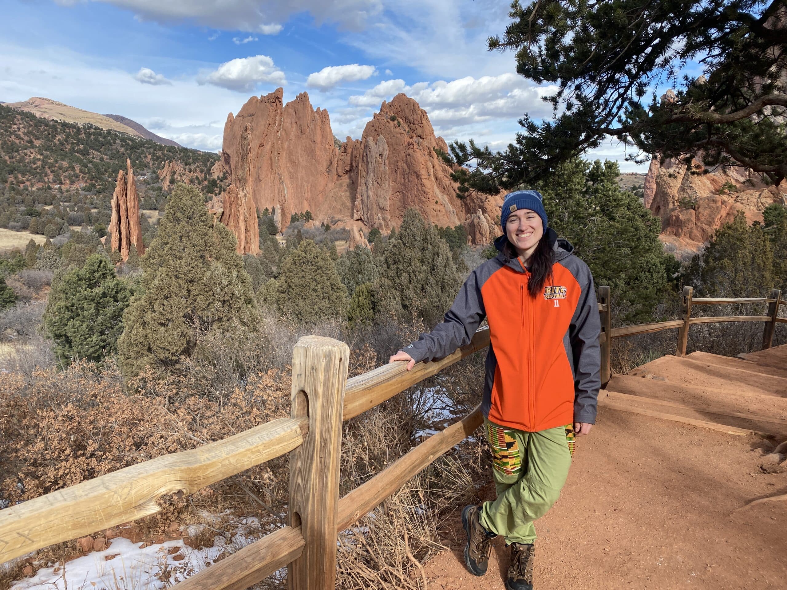 Melissa standing in front of a landscape backdrop